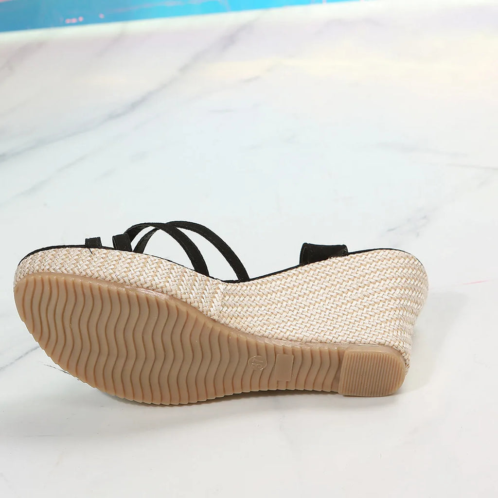 Women's black wedge sandals with fish mouth open toe and cloth upper on a white background.