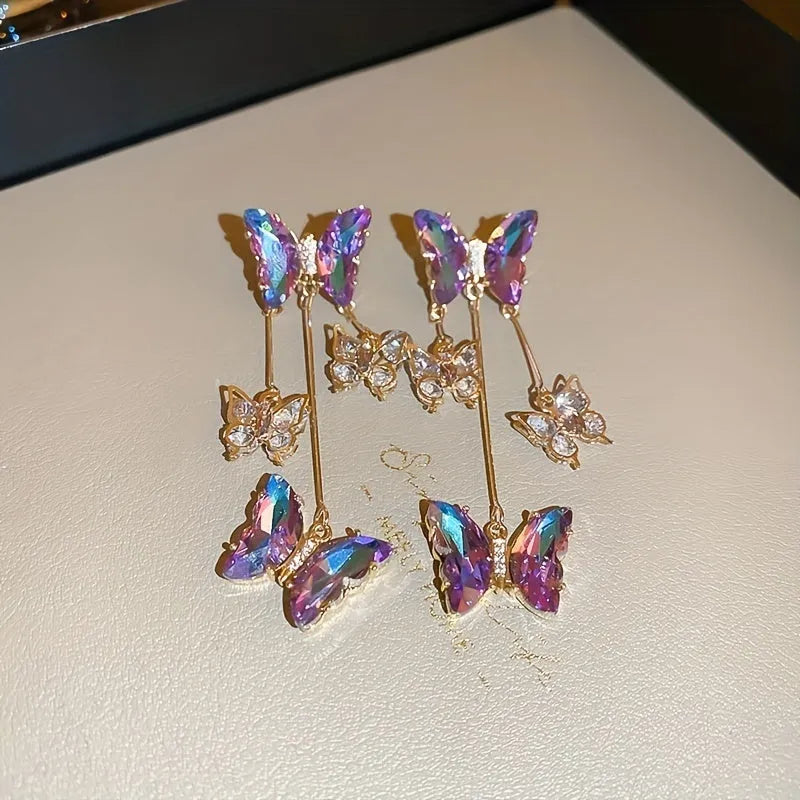 Silver Needle blue purple butterfly tassel earrings with crystal flowers on alloy chains, showing 7cm drop length.
