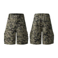 Retro loose-fit workwear shorts for men and women in washed cotton with a zipper fly, shown in grey colour.