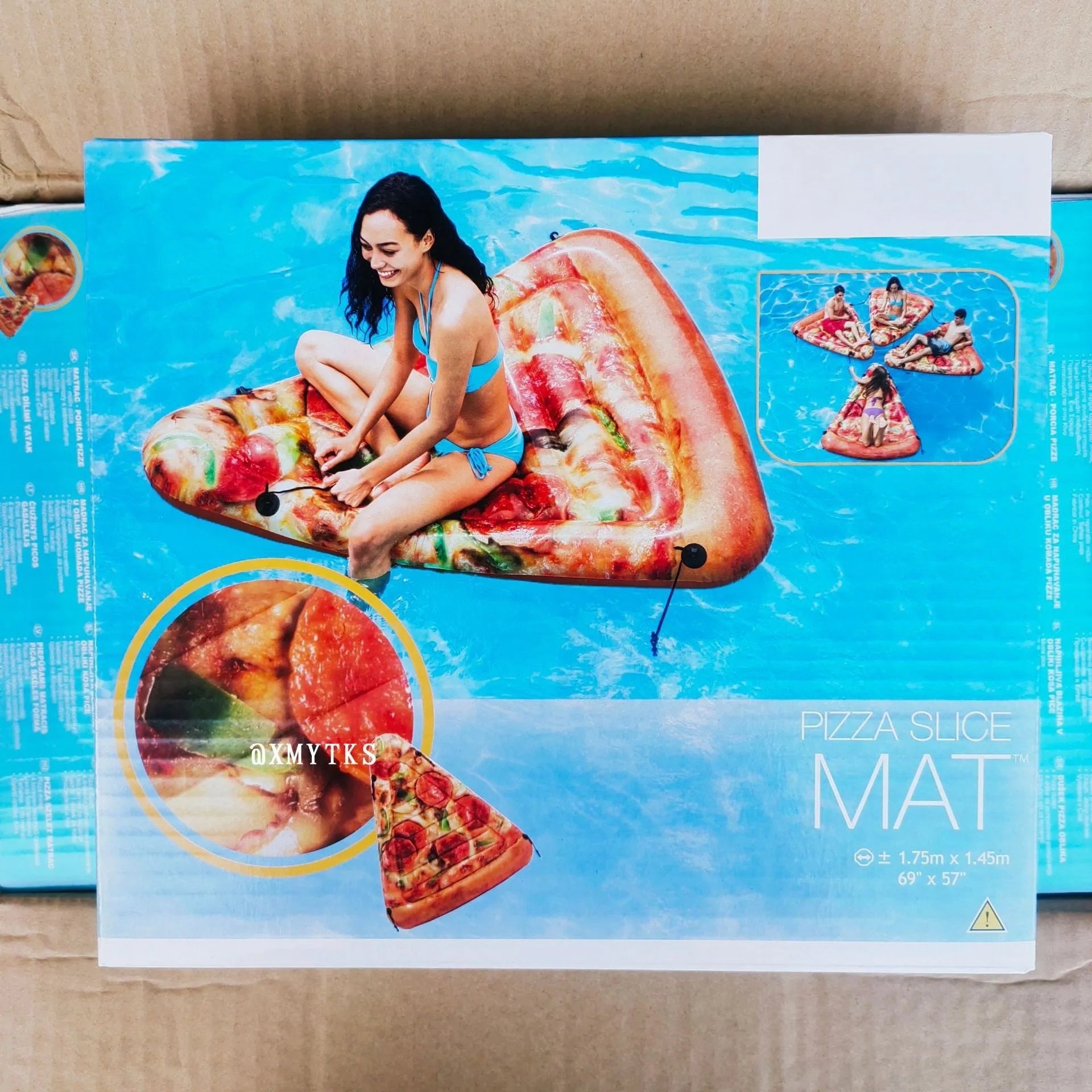 Large inflatable pizza-themed surfboard recliner floating in water