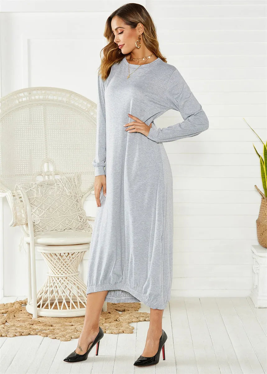 Black loose lantern dress with lace-up crew neck detail on a hanger.
