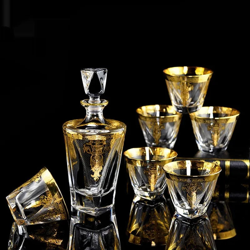Crystal glass whisky tumbler set with gold line detailing, Nordic style, one wine bottle and six glasses on table