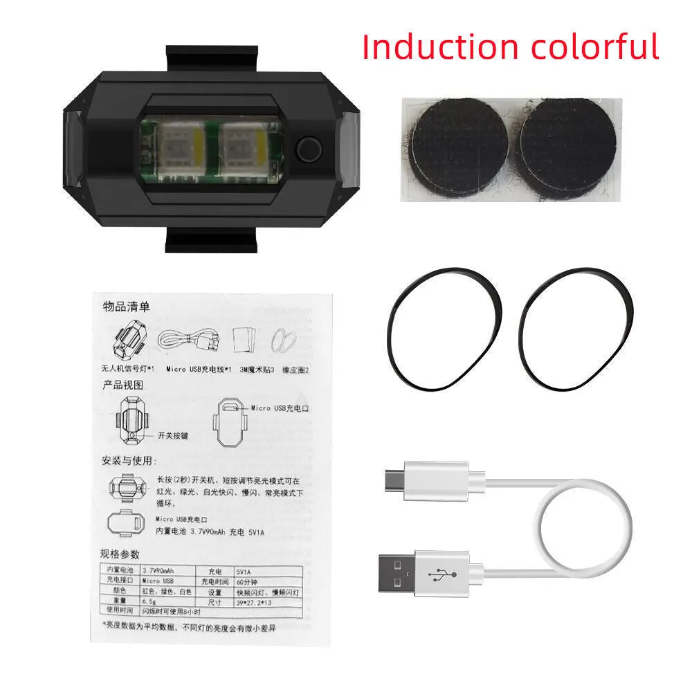 Drone strobe signal light with RGB LEDs next to Type-C charging cable and roll of mounting tape.