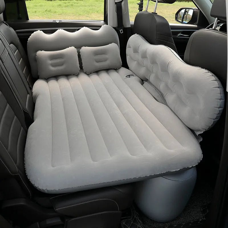 Inflatable car boot mattress with split design and grey flocked fabric, shown in an SUV rear.