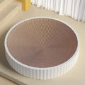 Round green and white cat scratching board with corrugated paper centre and two replacement refills.