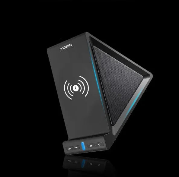 Matte black Bluetooth speaker with integrated phone stand and wireless charging pad on top.