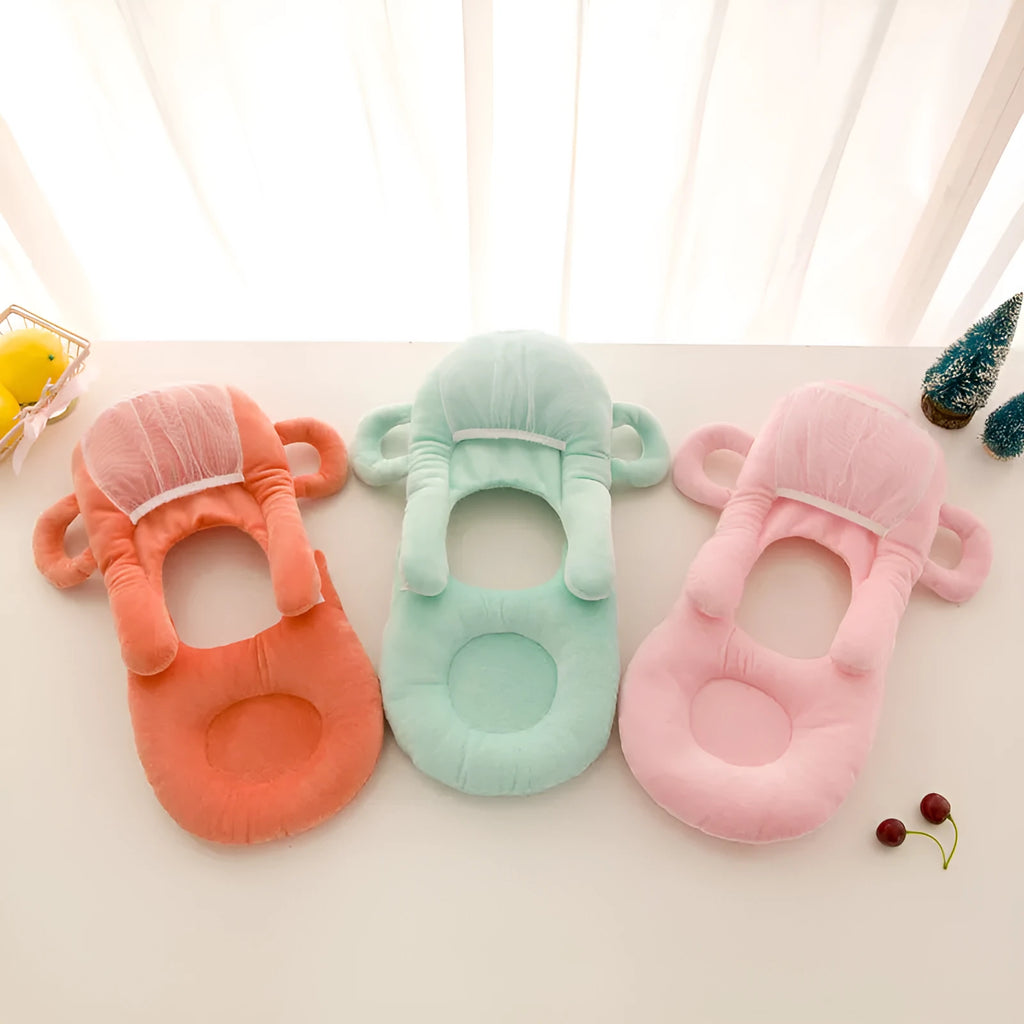 Plush confinement baby feeding pillow in soft colours, measuring 30cm by 42cm.