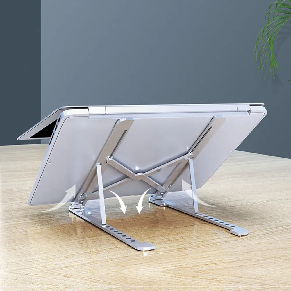 Aluminium foldable laptop stand in silver colour, shown open at an angle and folded flat.