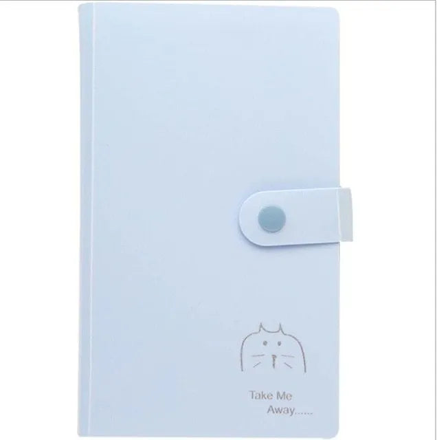Blue PVC business card holder book with a protective shell and smile logo, shown next to business cards.