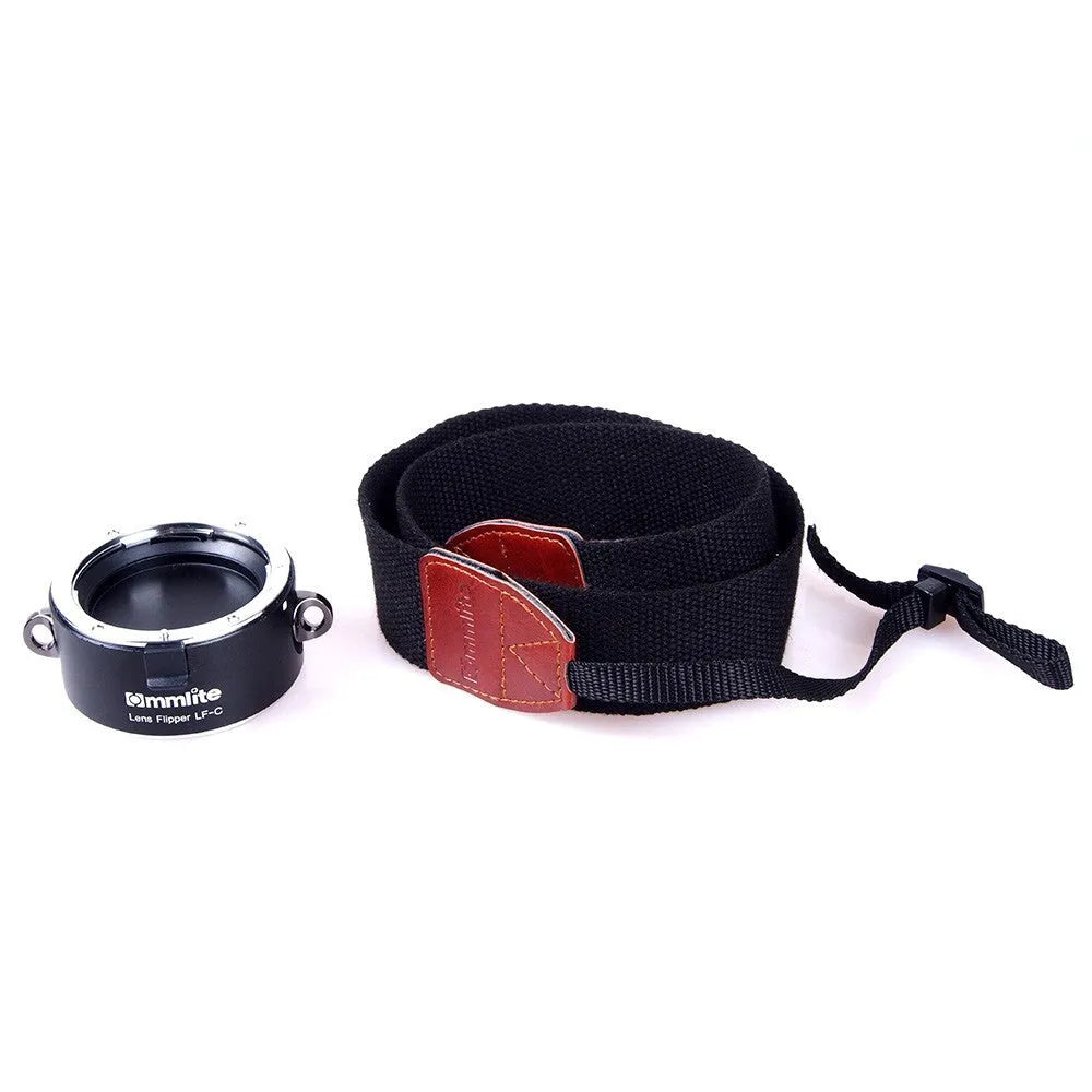 Aluminium alloy Nikon E-Mount camera lens flipper dual holder with cotton shoulder strap.