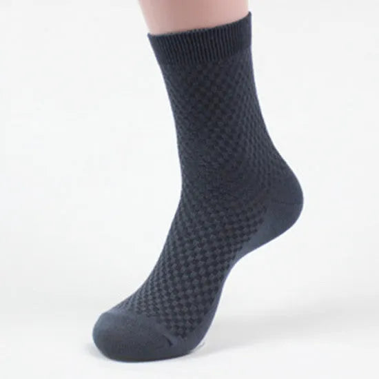 Men's bamboo fibre ankle socks in black, navy, silver grey, iron grey, and grey blue with a small square pattern.