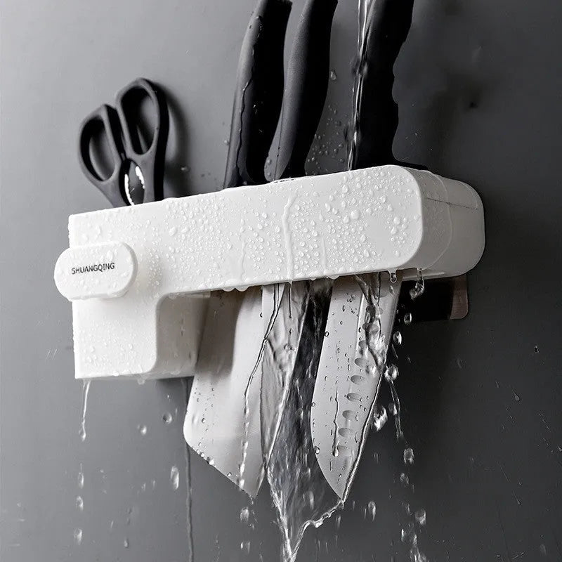 White plastic kitchen knife rack with modern simple design on countertop