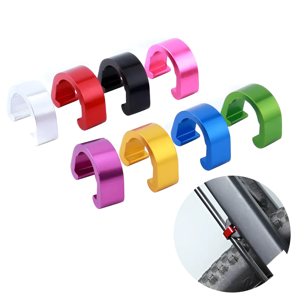 Ten small aluminium alloy C-shaped buckles in assorted colours on a white background.