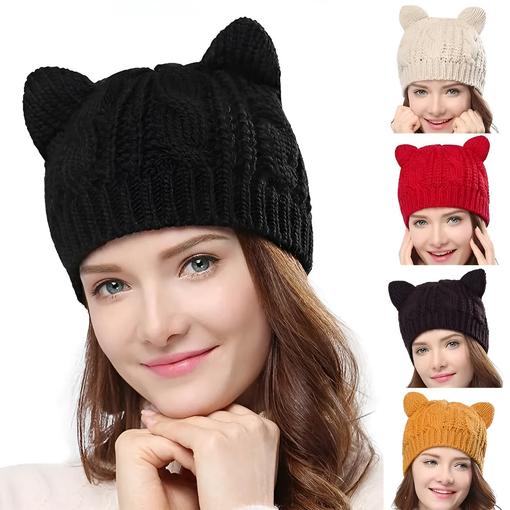 Handmade red knitted beanie with 3D cat ears and a pom pom on a mannequin head