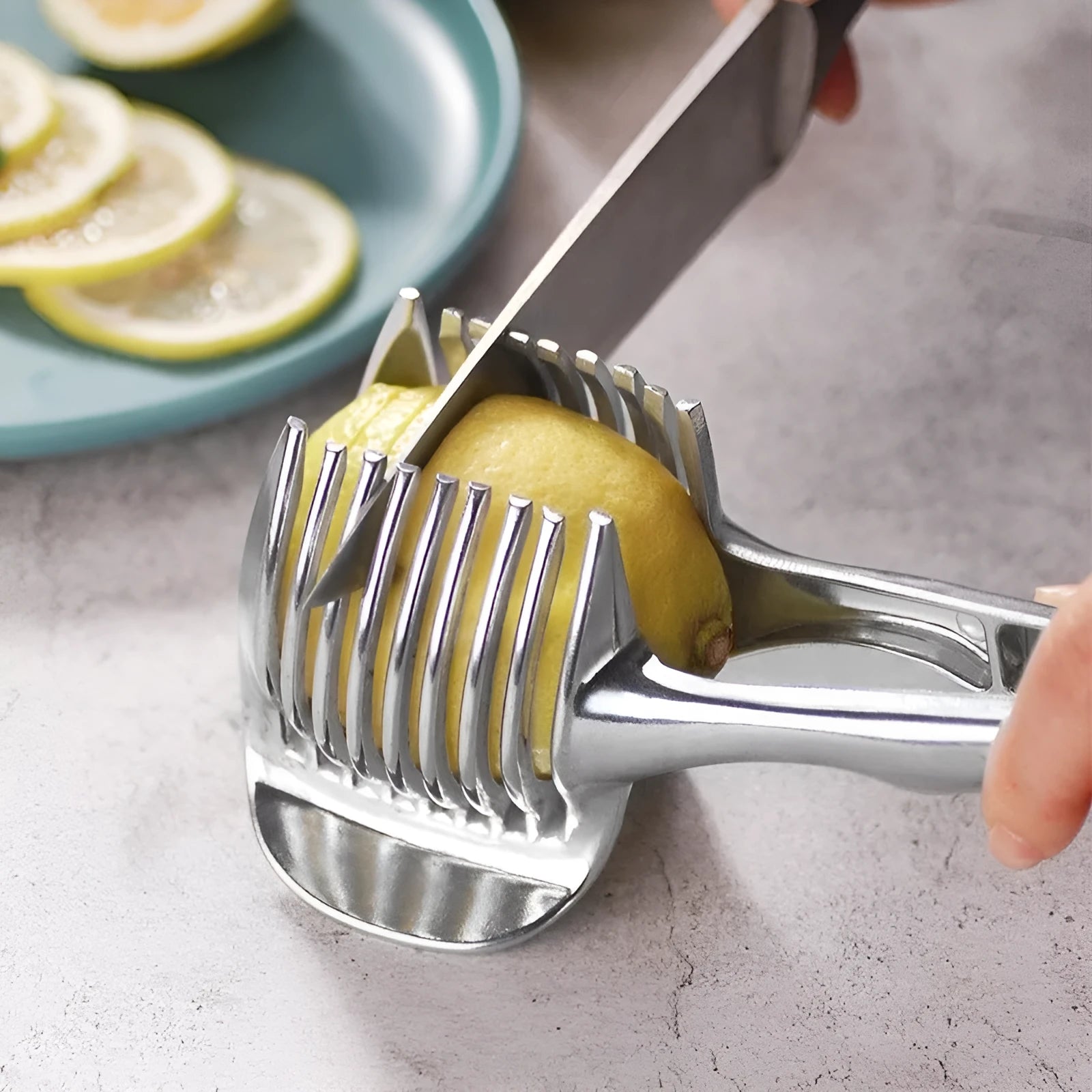 Silver plastic lemon slicer kitchen gadget for cutting fruits and vegetables