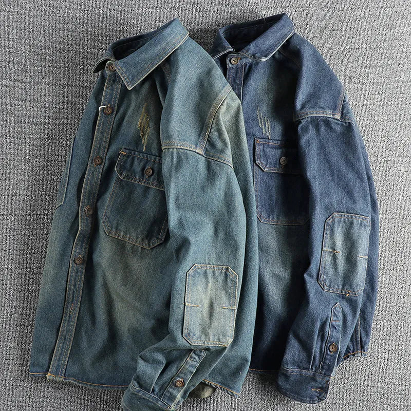Men's light blue loose-fit vintage denim shirt with long sleeves on a hanger.