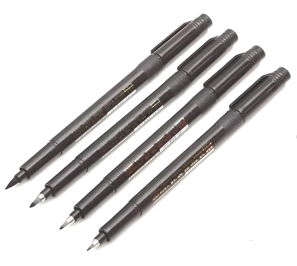 Set of four Japanese calligraphy brush pens and refills for ink drawing and sumi-e painting.