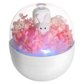 Pink ceramic rabbit vase with preserved flowers, functioning as an ultrasonic aromatherapy humidifier.