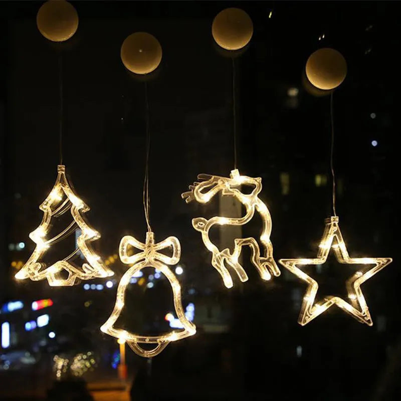 LED suction cup chandelier with Santa Claus, elk, and snowman shapes hanging on a window