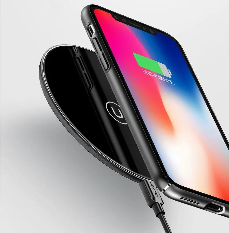Black glass disc wireless charger with LED indicator light on smooth surface
