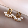 Female baroque pearl dangle drop earrings with silver or gold plated alloy finish and mosaic pearl colour