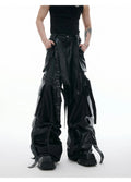 Black loose-fit trousers with a quilted pattern and multiple pockets on a mannequin.