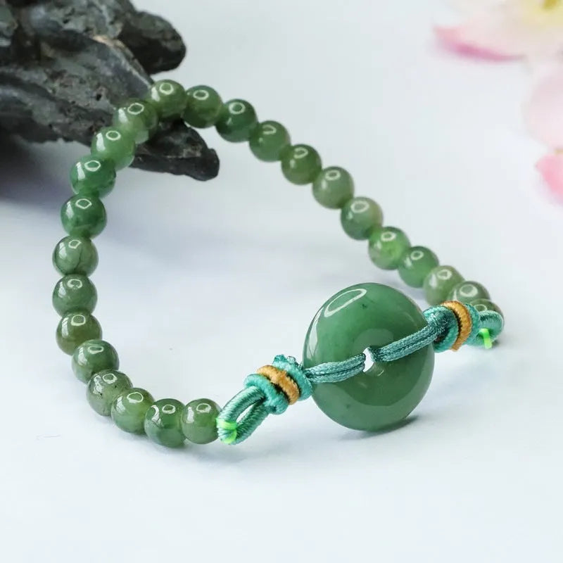 Emerald green jade bracelet with Chinese safety buckle and star-shaped 6mm beads.