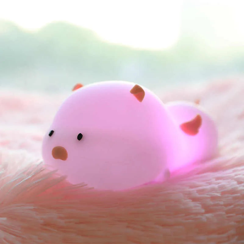 Blue silicone pig night light with sleeping expression and rechargeable battery