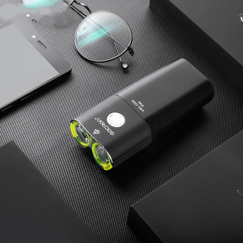Waterproof bicycle headlight 1600 lumens CREE XML2 with power bank, black, mounted on handlebar
