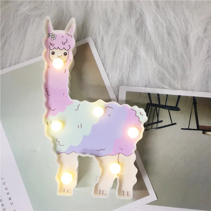 Alpaca night light 19cm tall in white colour on bedside table