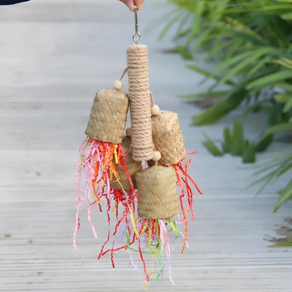 Shredded paper bird toy with colourful paper strips on wooden frame with sisal rope, measuring 15 by 35cm