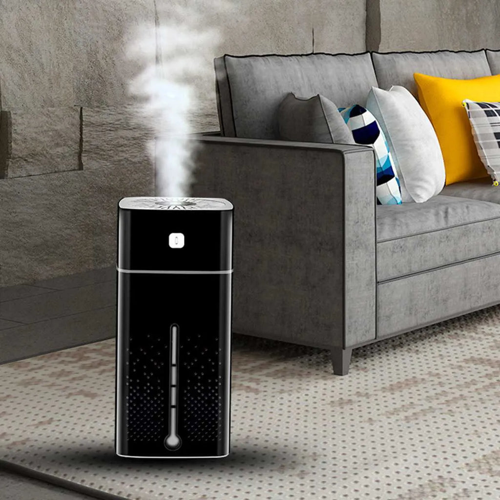Black and white desktop USB humidifier with 1000ml water tank on a wooden desk.