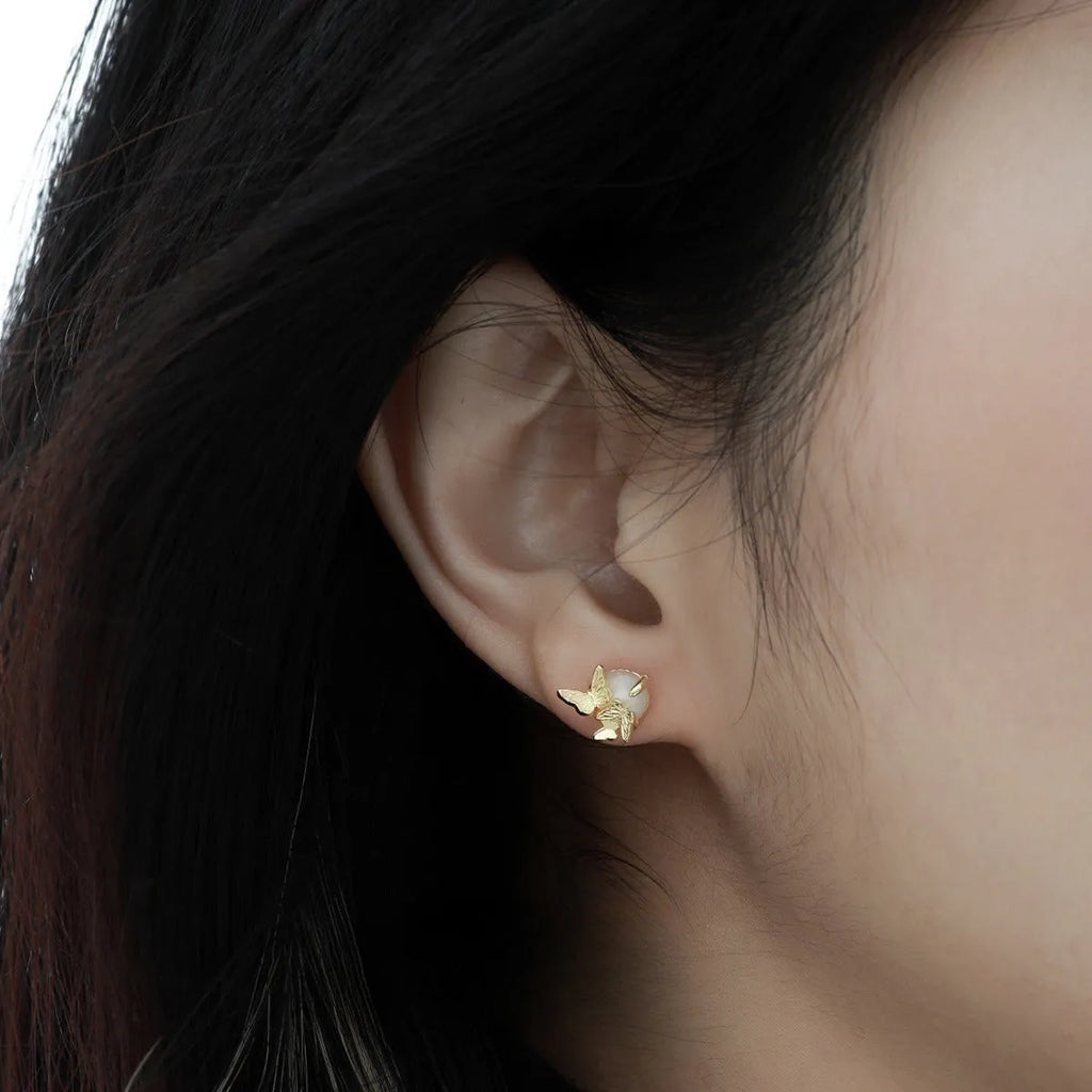 Pair of butterfly stud earrings in 925 silver with gold or white gold electroplated finish.