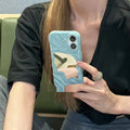 Beige iPhone case with a water ripple texture and a mirrored strip on the back.