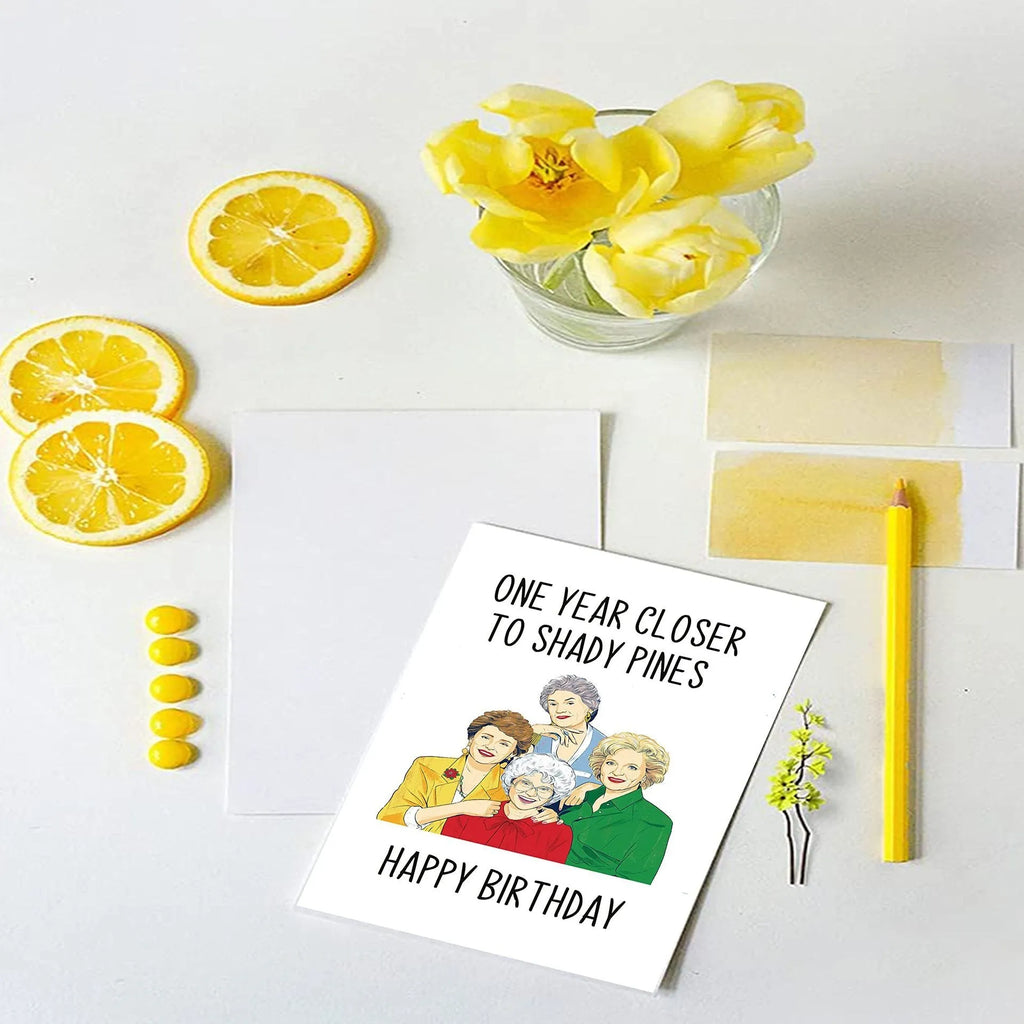 Modern printed birthday greeting card with a selection of coloured envelopes: yellow, purple, pink, red, and kraft paper.