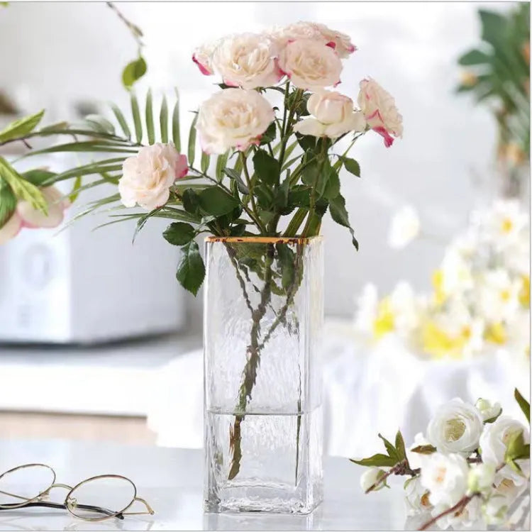 Set of three transparent gold-painted glass vases in 8x20CM, 8x25CM, and 8x30CM on a table