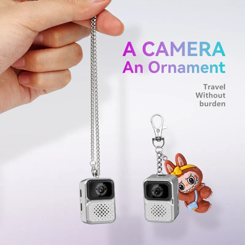 Mini sports camera HD video thumb camera in black plastic body with lens and mode button