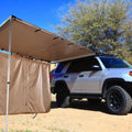Black glue waterproof two-bedroom camping tent with aluminium poles set up outdoors.