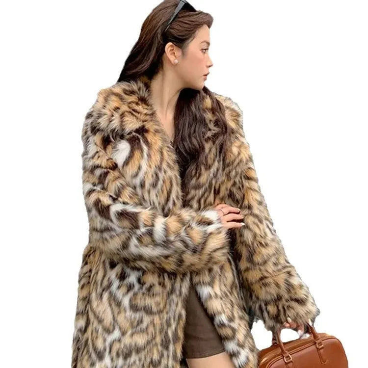 A model wearing a long faux fur coat with a fur collar and pockets.