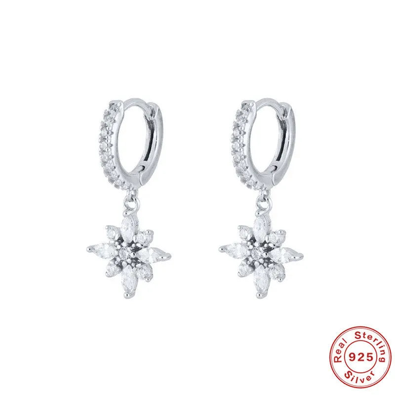 Sterling silver snowflake pendant earrings with gemstones in yellow or white gold plating.
