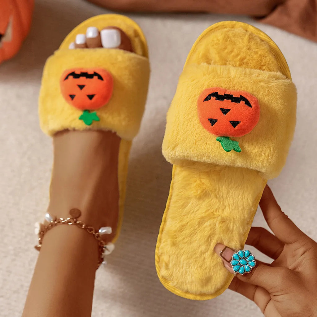 White and yellow cartoon pumpkin plush open-toe slippers with a synthetic fur upper and PVC sole.