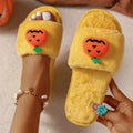 White and yellow cartoon pumpkin plush open-toe slippers with a synthetic fur upper and PVC sole.