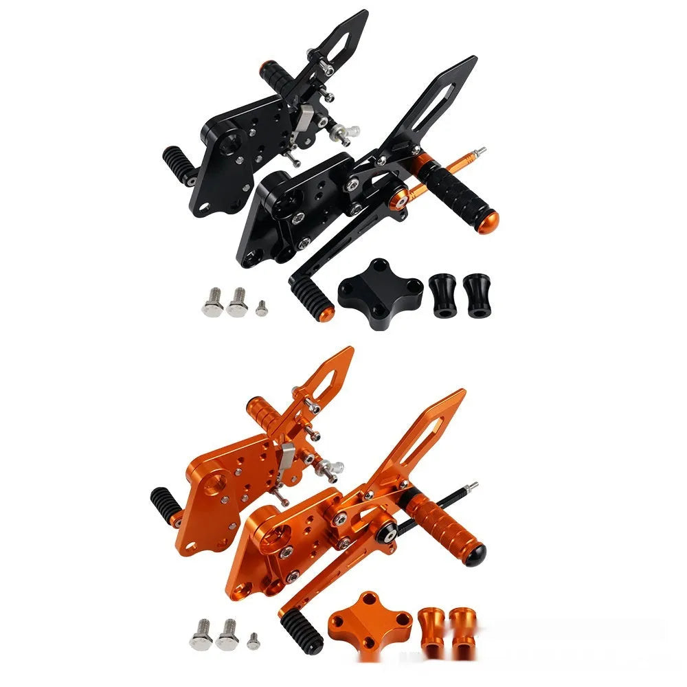 Black and orange KTM Duke motorcycle rear shift pedal support bracket assembly.