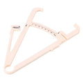 Acrylic skin fold caliper body fat measuring instrument showing scale and measurement jaws