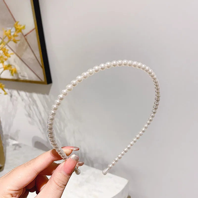 Thin imitation pearl headband on metal base approximately 14cm, available in Pearl A Pearl B Pearl C colours