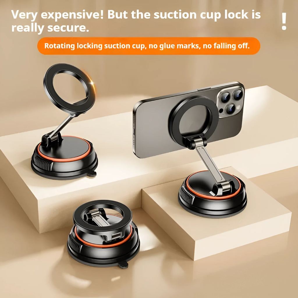 Foldable metal magnetic car phone holder in black and orange on a dashboard