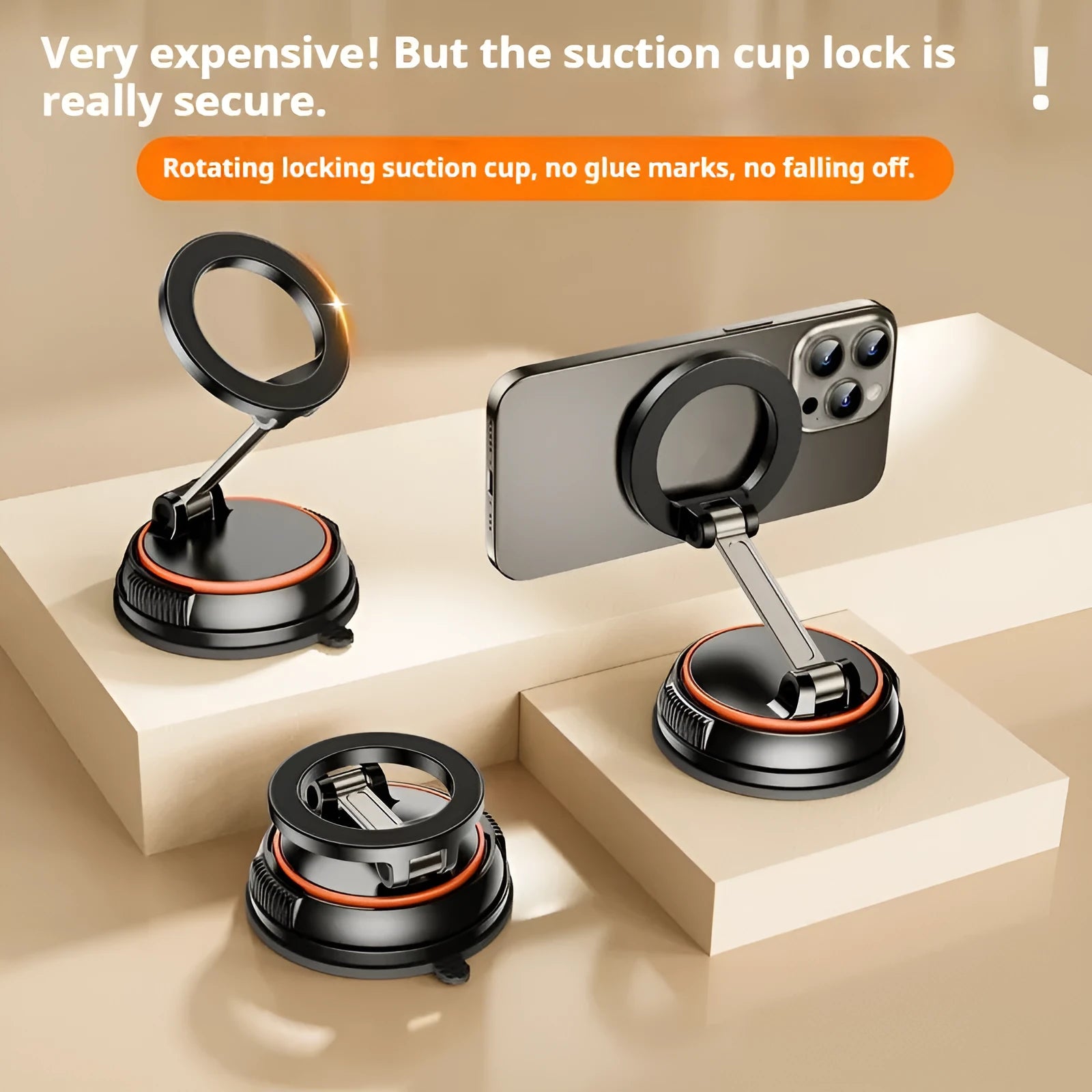 Foldable metal magnetic car phone holder in black and orange on a dashboard