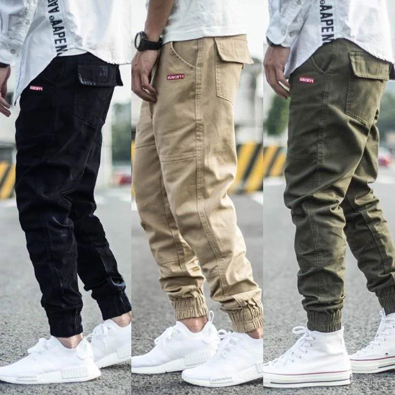 Men's casual tight-fitting pencil trousers in Khaki, front view, zipper placket visible