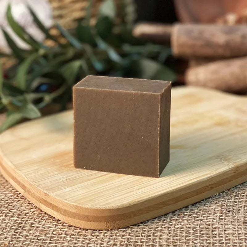 A 72-gram bar of nine grass cold process shampoo soap, silicone oil-free.