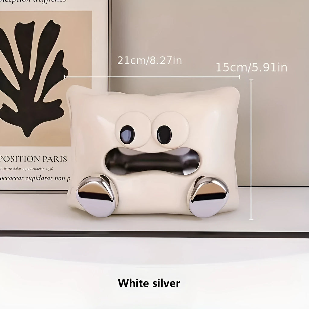 White ceramic tissue box holder with polished glazed finish on coffee table
